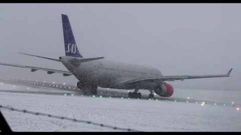 Airbus A330 aborting take off in a snowstorm (low visibility)