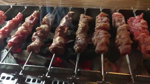 The process of grilling lamb skewers deliciously