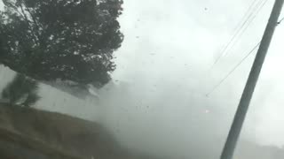 Small Tornado Crosses Busy Road