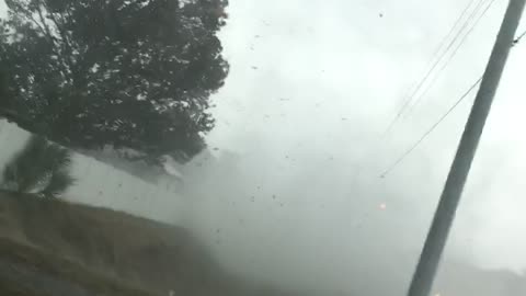 Small Tornado Crosses Busy Road
