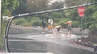 People are having fun in the Hurricane in California, beach style