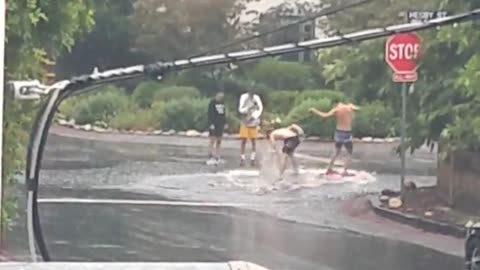 People are having fun in the Hurricane in California, beach style