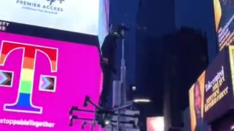 Guy Riding On A Drone In Times Square