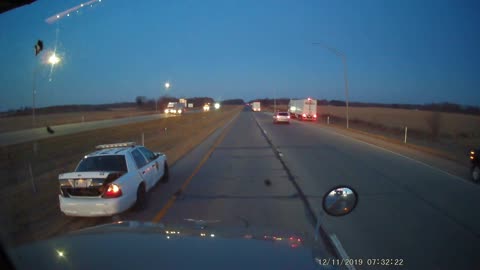 Squad Car Sent Spinning After Merging into Truck