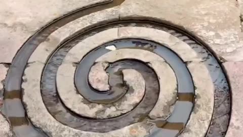 Spiral water irrigation path at the holy Hindu temple of Neelkanth Mahadev in India, calming