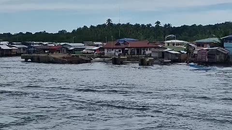 As you approach the port in Isabela, Basilan, the horizon is dotted with the homes of the Badjao!