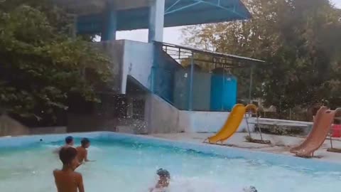 Children Play Happily in the Swimming Pool