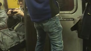 Blue jacket guy dances in subway window