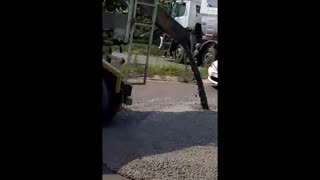 Striking Transnet workers pour concrete on a road in Richards Bay