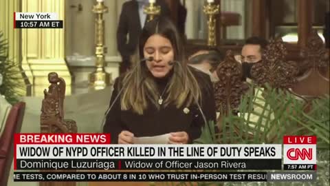 Officer Jason Rivera's widow at his funeral.