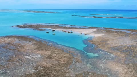 sandbar between coral reef