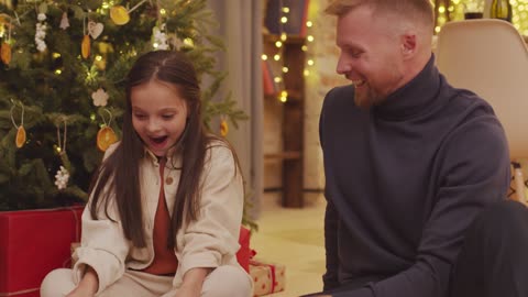 A Young Girl Surprised Reaction with her Christmas gift