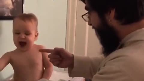 dad singing with his baby