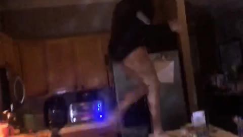 Girl dancing on top of island kitchen counter falls off sunglasses whitney houston