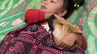 Little Girl Cuddles With Dog