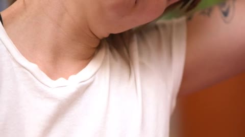 Girl stretching her neck before practicing yoga