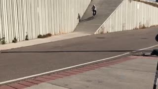 Guy on scooter goes down large ramp falls back