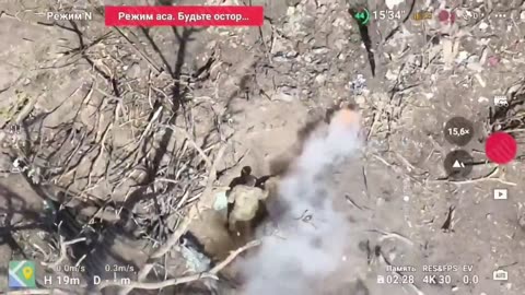 Ukrainian soldier shovels dirt on an incendiary grenade but it explodes