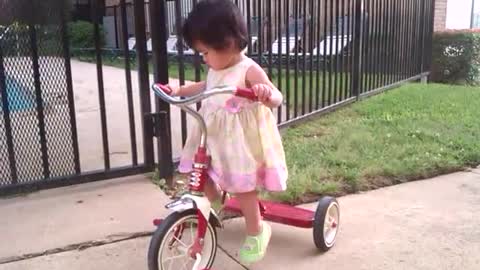 Toddler Girl Too Short To Pedal Her Tricycle