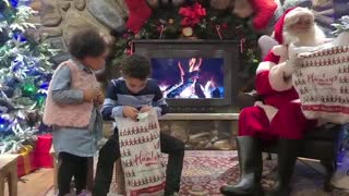 Little Girl Surprises Brother with Question About Santa's Gift