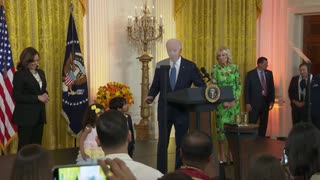 Biden calls on two little kids to join him on stage