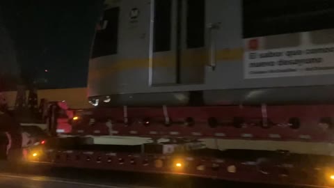 Light Rail Train Cars On Large Flatbed Vehicle