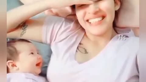 Adorable moment between baby and mother.