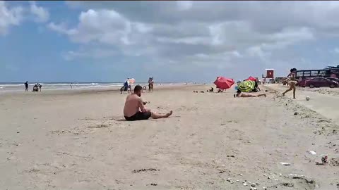 Man Falls Trying to Pass Soccer Ball at the Beach