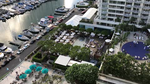Poolside party under tropical cloud cover at The Modern hotel, Waikiki