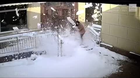 Woman falls into deep snow trying to reach for chilled wine