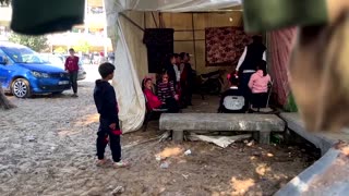 Gazan teaches English to displaced children in tent