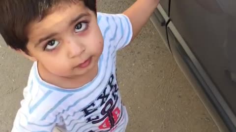 One Year old baby trying to open his car lock