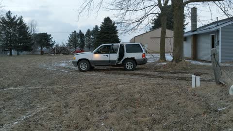 Car Tied To Tree Drives Off