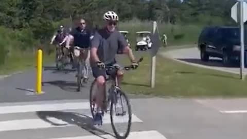 Biden falls off his bike after trying to dismount!