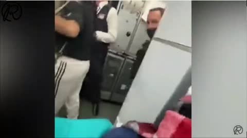 American Airlines Passenger Duct-Taped to Seat & Mouth Sealed Shut After Trying to Open Plane Door!
