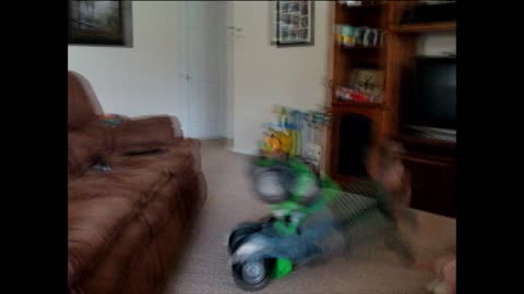 Toddler Faceplants After Riding ATV Toy Off Sofa