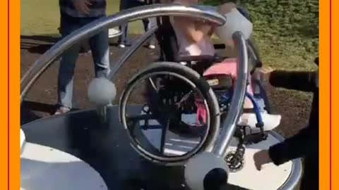 disabled child playing on the spinner