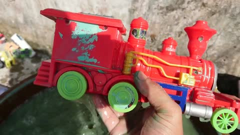 Clean up toy cars fire truck, sand truck, tanker truck, excavator, train, race car, f1 car, tayo