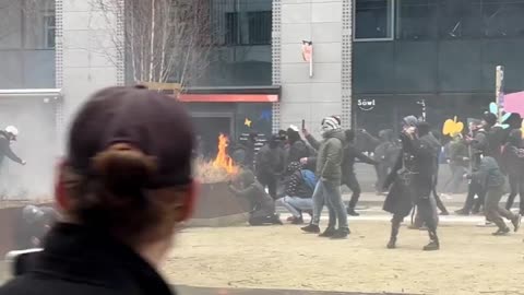 Rioters fight police in Brussels.