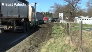 Truck carrying contaminated dirt overturns in E. Palestine.