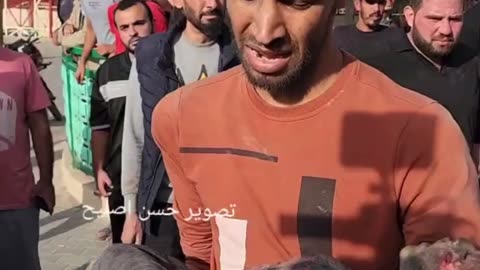 Palestinian Man Holds His Dead Child