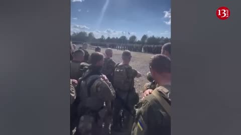 Taking an oath, soldiers of “Svoboda" battalion are preparing for an attack