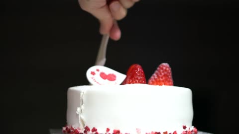 Birthday cake cutting.