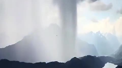 The sky has broken over Lake Hallstetter in Austria