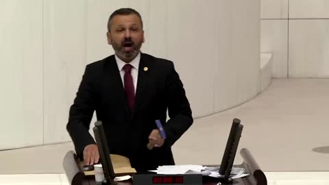 Turkish lawmaker smashes phone with hammer