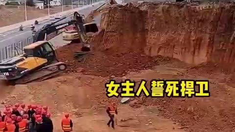 🇨🇳 Facing house demolition, woman vows to defend it! 🤬