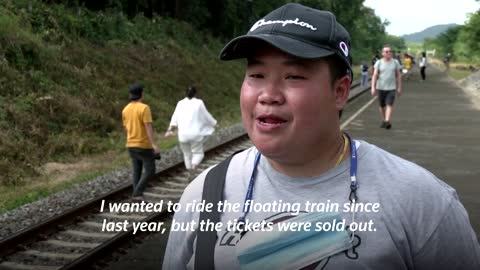 Thailand's 'floating train' a hit as dam waters rise