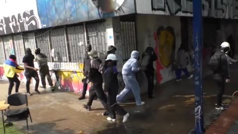 Breaking in Colombia: Molotov Cocktails Vs. Water Cannon: