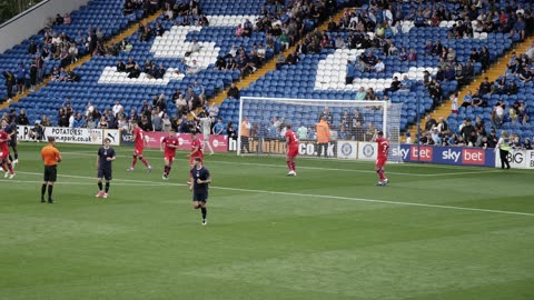 Stockport County play in 1883 kit