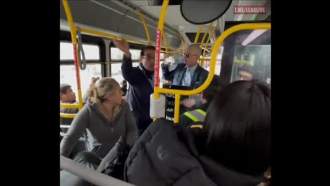 Blue haired person and man with a sign have a disagreement on a bus.
